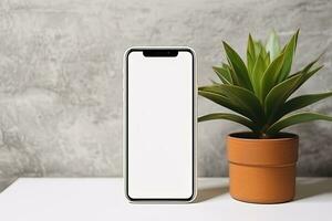 Smartphone Attrappe, Lehrmodell, Simulation mit leer Bildschirm und saftig Pflanze auf hölzern Tabelle ai generiert foto