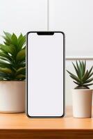 Attrappe, Lehrmodell, Simulation Smartphone mit leer Bildschirm auf Tabelle mit Grün Pflanze ai generiert foto