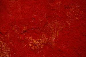 dunkel rot Hintergrund Textur von ein gemalt Mauer foto