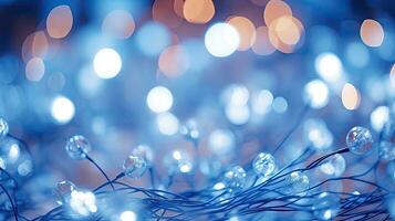 ai generativ Weihnachten Beleuchtung auf ein Blau Hintergrund mit Bokeh Wirkung. Weihnachten Hintergrund. Nahansicht Aussicht mit Tiefe von abgelegt. foto