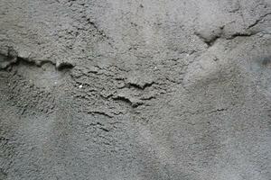 uneben Zement und Sand Mauer Textur Hintergrund, grungy Zement Mauer Oberfläche, rustikal Sand Mauer foto