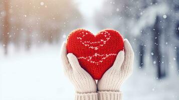 weiblich Hände im Fäustlinge halten rot Herz auf schneebedeckt Winter Hintergrund. generativ ai foto