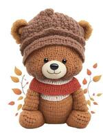 braun gestrickt Teddy Bär im ein Grafik Hut zum Herbst foto