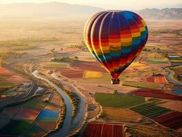 ein heiß Luft Ballon schwebend Über ein Patchwork von bunt Felder generativ ai foto