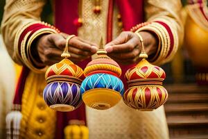 ein Mann im traditionell indisch Kleidung hält drei bunt Ornamente. KI-generiert foto