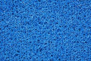 Hintergrund der blauen Teppich- oder Fußschaber- oder Türmattenbeschaffenheit