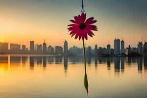 ein Rosa Blume hängend von ein Haken im Vorderseite von ein Stadt Horizont. KI-generiert foto
