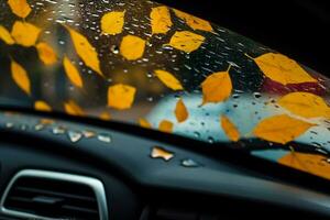 Herbst Blätter und Regentropfen auf das Windschutzscheibe von ein Wagen. Innerhalb Sicht. selektiv Fokus. generativ ai. foto