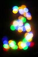 Nummer 3 gemacht mit das Bokeh von Weihnachten Beleuchtung foto