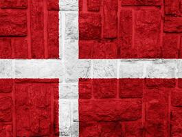 Flagge von Dänemark auf ein texturiert Hintergrund. Konzept Collage. foto