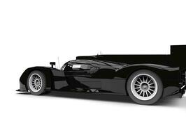 Super glänzend schwarz modern Rennen Auto - - Schwanz Seite Aussicht foto