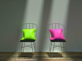 zwei Metall Stühle mit Grün und Rosa Kissen foto