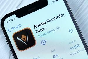 Charkow, Ukraine - - März 5, 2021 Adobe Illustrator Symbol und Anwendung von App Geschäft auf iPhone 12 Profi Anzeige Bildschirm auf Weiß Tabelle foto