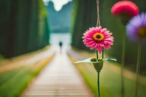 ein Rosa Blume ist auf ein hölzern Gehweg. KI-generiert foto