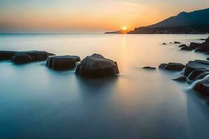 ein lange Exposition fotografieren von Felsen im das Wasser beim Sonnenuntergang. KI-generiert foto