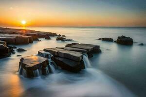 ein lange Exposition fotografieren von Felsen im das Ozean beim Sonnenuntergang. KI-generiert foto