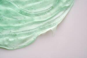transparent klar Grün Flüssigkeit Serum Gel kosmetisch Textur Hintergrund foto
