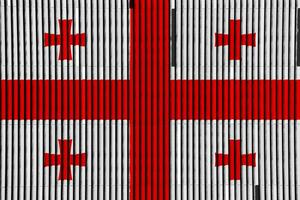 Flagge von Georgia auf ein texturiert Hintergrund. Konzept Collage. foto
