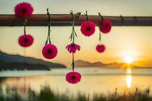 Rosa Blumen hängend von ein Bambus Pole beim Sonnenuntergang. KI-generiert foto