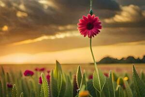 ein Rosa Blume ist Stehen im ein Feld mit ein wolkig Himmel. KI-generiert foto