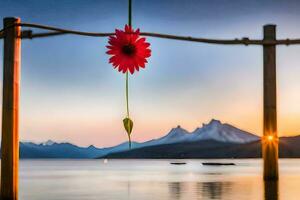 ein rot Blume hängend von ein Pole Über ein See. KI-generiert foto