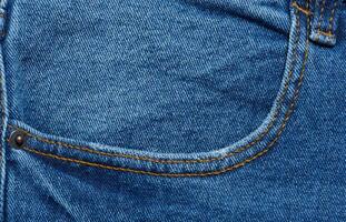 Blau Jeans Vorderseite Tasche mit Tasten, schließen oben foto
