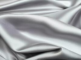 Silber Satin- Stoff Textur Hintergrund. foto