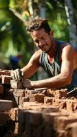 Mason Verlegung Ziegel zu bauen ein Mauer foto