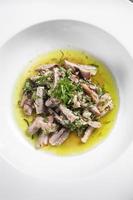 mariniertes Schweinefleisch mit Knoblauch und Koriander Olivenölsauce Gourmet-Tapas-Gericht