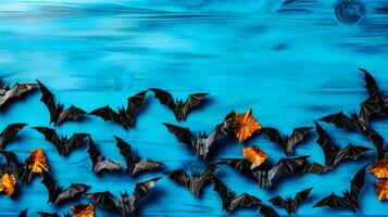 Gruppe von Origami Fledermäuse schwebend auf Blau Oberfläche mit Wasser im das Hintergrund. generativ ai foto