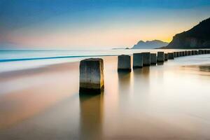 ein lange Exposition fotografieren von ein Strand mit Felsen im das Wasser. KI-generiert foto