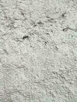 das Textur und Hintergrund von das Weiß Zement Stein Mauer ist Rau und wellig foto