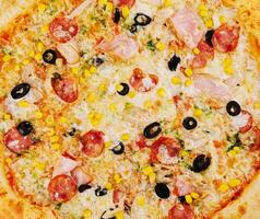 lecker Pizza schließen oben Hintergrund oder Textur foto