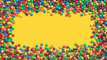 bunt beschichtet Schokolade Süßigkeiten Rahmen auf Gelb Hintergrund foto