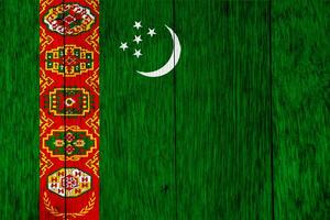 Flagge von Turkmenistan auf ein texturiert Hintergrund. Konzept Collage. foto