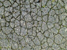 Asphalt Oberflächen von anders Straßen und Straßen mit Risse im schließen oben foto