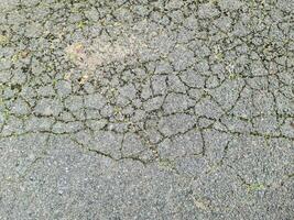 Asphalt Oberflächen von anders Straßen und Straßen mit Risse im schließen oben foto