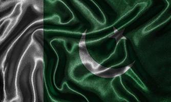 Tapete von pakistanischer Flagge und wehende Flagge von Stoff. foto