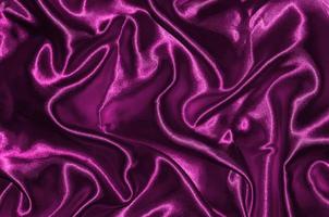 Hintergrund und Tapete aus rosa Stoff und gestreiftem Textil foto