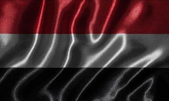Tapete von Jemen-Flagge und wehende Flagge von Stoff. foto