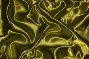 Hintergrund und Tapete aus gelbem Stoff und gestreiftem Textil
