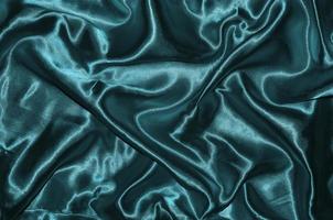 Hintergrund und Tapete aus blauem Stoff und gestreiftem Textil foto