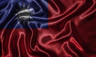 Tapete von Taiwan-Flagge und wehende Flagge von Stoff. foto