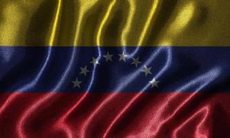 Tapete von Venezuela-Flagge und wehende Flagge von Stoff. foto