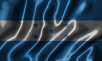Tapete von Honduras-Flagge und wehende Flagge von Stoff. foto