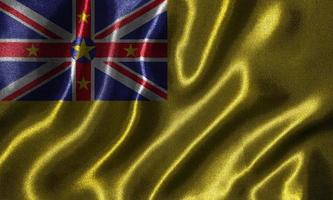 Tapete von Niue Flag und wehende Flagge von Stoff.