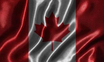 Tapete von Kanada-Flagge und wehende Flagge von Stoff. foto