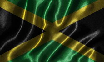 Tapete von Jamaika-Flagge und wehende Flagge von Stoff.