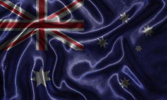 Tapete von Australien-Flagge und wehende Flagge von Stoff. foto