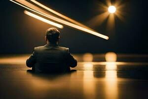 ein Mann Sitzung im das dunkel mit Beleuchtung leuchtenden auf ihn. KI-generiert foto